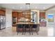 Modern kitchen features a spacious island with seating and high-end stainless steel appliances at 12147 S Shady Pine Ct, Parker, CO 80134