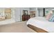 Spacious main bedroom with carpet, with an ensuite bathroom, walk-in closet, and dresser at 12147 S Shady Pine Ct, Parker, CO 80134