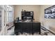 This home office has custom cabinets, hardwood floors, natural light, and is a great place to get work done at 12147 S Shady Pine Ct, Parker, CO 80134