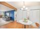 Dining area showcasing stylish lighting, access to the living room, and closet space at 10251 W 44Th Ave # 7-106, Wheat Ridge, CO 80033
