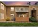 A charming condo exterior with a private patio area and balcony under a beautiful sunset sky at 10251 W 44Th Ave # 7-106, Wheat Ridge, CO 80033