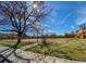 Community tennis court featuring a fenced perimeter, and mature trees adds to the neighborhood charm at 10251 W 44Th Ave # 7-106, Wheat Ridge, CO 80033