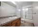 Clean bathroom with single vanity and shower/tub combo at 118 S Eldridge Way, Golden, CO 80401