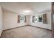 Well-lit bedroom with carpet and large windows at 118 S Eldridge Way, Golden, CO 80401