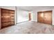 Simple bedroom with wood shelving and double doors at 118 S Eldridge Way, Golden, CO 80401