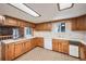 Well-equipped kitchen featuring wood cabinets and built-in appliances at 118 S Eldridge Way, Golden, CO 80401