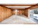 Living room boasts wood paneling, fireplace, and large window at 118 S Eldridge Way, Golden, CO 80401