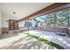 Covered patio with snow-covered ground and surrounding trees at 118 S Eldridge Way, Golden, CO 80401