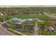 Aerial view of neighborhood amenities with swimming pools, parking, parks and tennis courts at 10125 Quarry Hill Pl, Parker, CO 80134