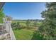 Well-maintained backyard with lush green grass, a wooden fence, and scenic views at 10125 Quarry Hill Pl, Parker, CO 80134