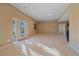 Finished basement with walkout access, neutral carpet, and recessed lighting at 10125 Quarry Hill Pl, Parker, CO 80134