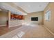 Basement area complete with a bar area with wooden cabinets, and tile flooring at 10125 Quarry Hill Pl, Parker, CO 80134
