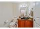 Small bathroom with sleek, modern fixtures and under-sink storage at 10125 Quarry Hill Pl, Parker, CO 80134