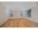 Serene bedroom with hardwood floors and large windows for ample natural light at 10125 Quarry Hill Pl, Parker, CO 80134