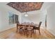 Elegant dining room featuring hardwood floors, a unique ceiling, and ample natural light at 10125 Quarry Hill Pl, Parker, CO 80134
