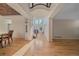 Bright and airy foyer with gleaming hardwood floors and an open staircase at 10125 Quarry Hill Pl, Parker, CO 80134