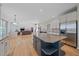 Open concept: island kitchen overlooks the main living area with fireplace at 10125 Quarry Hill Pl, Parker, CO 80134