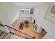 Bright living room with large windows, fireplace, hardwood flooring and comfortable leather furniture at 10125 Quarry Hill Pl, Parker, CO 80134