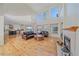 Spacious living room with hardwood floors, a fireplace, and soaring high ceilings at 10125 Quarry Hill Pl, Parker, CO 80134