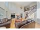 Inviting living room showcasing a fireplace, hardwood floors, and an open staircase at 10125 Quarry Hill Pl, Parker, CO 80134