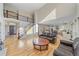 Bright living room features an open staircase and hardwood floors at 10125 Quarry Hill Pl, Parker, CO 80134