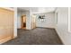 Spacious bedroom with carpet, closet, and a view into the bathroom at 10508 Christopher Dr, Conifer, CO 80433