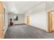 Large bedroom with multiple windows, carpet, and views outside at 10508 Christopher Dr, Conifer, CO 80433