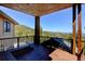 Spacious deck with wood plank flooring and mountain view at 10508 Christopher Dr, Conifer, CO 80433