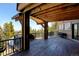 The wooden deck of the home provides stunning views of the mountainous landscape at 10508 Christopher Dr, Conifer, CO 80433