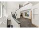 A bright entryway features high ceilings and a staircase at 10508 Christopher Dr, Conifer, CO 80433