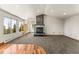Living room featuring an oversized fireplace, carpeting, and hardwood flooring at 10508 Christopher Dr, Conifer, CO 80433