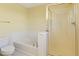 This bathroom features a soaking tub, a walk-in shower, and a toilet at 8335 E 22Nd Ave, Denver, CO 80238