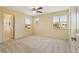 Spacious carpeted bedroom with bright natural light from double windows at 8335 E 22Nd Ave, Denver, CO 80238
