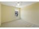 This bedroom features neutral paint, carpet, and a sunny window at 8335 E 22Nd Ave, Denver, CO 80238
