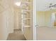 This walk-in closet has adjustable shelving and carpet at 8335 E 22Nd Ave, Denver, CO 80238
