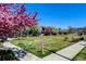 Beautiful community view featuring colorful trees and well-maintained green spaces at 8335 E 22Nd Ave, Denver, CO 80238