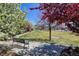 Scenic park view featuring blooming trees and a park bench for relaxing outdoors at 8335 E 22Nd Ave, Denver, CO 80238