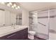 Modern bathroom featuring vanity, toilet, and glass-enclosed shower with modern fixtures at 13691 E Marina Dr # 107, Aurora, CO 80014