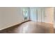 Spacious bedroom featuring a window and closet space with dark wood-look floors at 13691 E Marina Dr # 107, Aurora, CO 80014