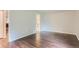 A bright bedroom with an ensuite bath and modern dark wood-look floors at 13691 E Marina Dr # 107, Aurora, CO 80014