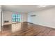 Open living area with hardwood flooring and a sliding glass door to balcony at 13691 E Marina Dr # 107, Aurora, CO 80014