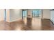 Spacious living room featuring hardwood floors and large sliding glass doors at 13691 E Marina Dr # 107, Aurora, CO 80014
