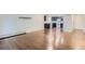 Large living room with hardwood floors and kitchen view at 13691 E Marina Dr # 107, Aurora, CO 80014