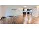 Spacious living room with hardwood floors adjacent to modern kitchen at 13691 E Marina Dr # 107, Aurora, CO 80014
