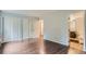 A bright main bedroom with ample closet space with modern dark wood-look floors at 13691 E Marina Dr # 107, Aurora, CO 80014