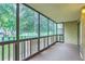 Enclosed patio offering views of mature trees and outdoor space at 13691 E Marina Dr # 107, Aurora, CO 80014