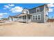 The backyard features a porch, a patio, and plenty of space at 2177 Garden Ave, Brighton, CO 80601