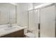 Bathroom with glass enclosed shower and sink with contemporary faucet and fixtures at 2177 Garden Ave, Brighton, CO 80601
