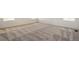 Spacious carpeted bedroom with neutral colored carpet and white trim at 2177 Garden Ave, Brighton, CO 80601