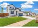 Charming two-story home with landscaped front yard, covered porch, and a two car garage at 2177 Garden Ave, Brighton, CO 80601